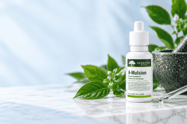 Genestra A-Mulsion dropper bottle with fresh green leaves and a stone mortar